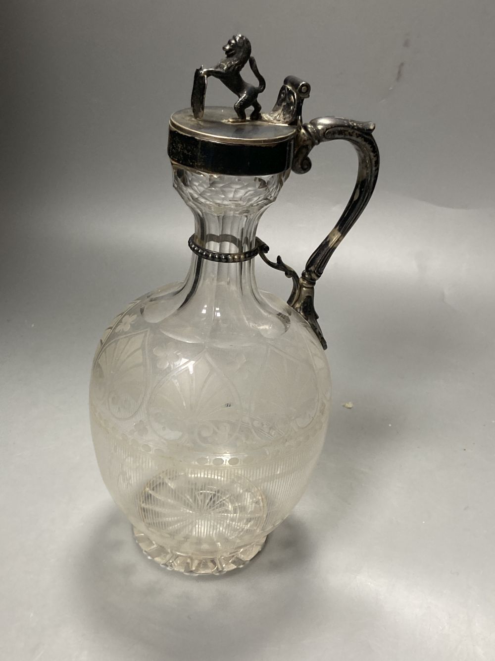 A Victorian silver mounted etched glass claret jug, of bulbous form, Richards & Brown, London, 1869, 25.7cm.